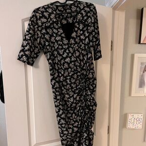 Veronica Beard fitted dress in black with floral. Slit up one side with tie